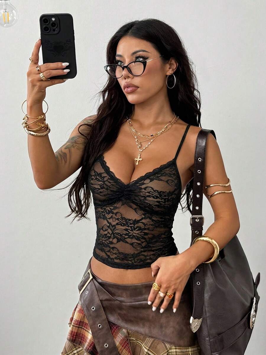 Women's black lace crop cami top featuring spaghetti straps, cold shoulder sleeves, and a sheer backless design.
