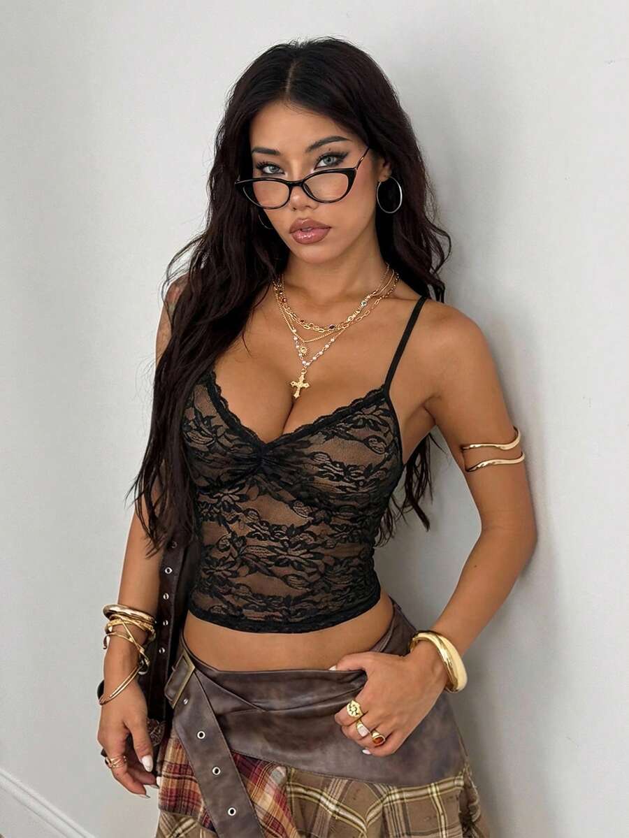 Women's black lace crop cami top featuring spaghetti straps, cold shoulder sleeves, and a sheer backless design.