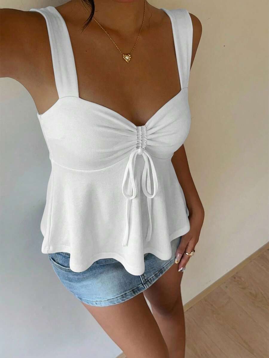 Women's white wide strap tank top with drawstring front, eyelet embroidery, ruffle hem, slim fit, and flared hem.