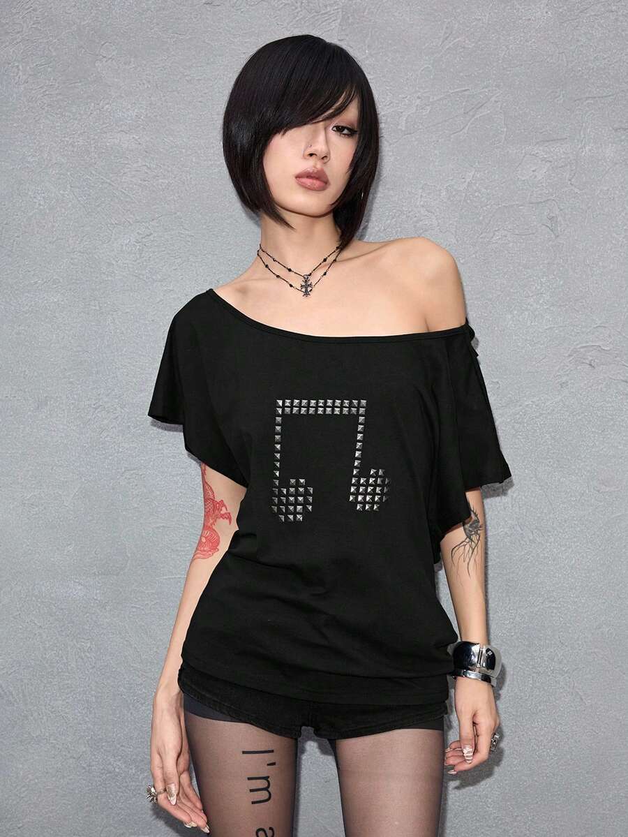 Women's grunge punk style short sleeve t-shirt featuring an asymmetrical neckline, hollow-out cut detail, and relaxed batwing sleeves in a soft cotton stretch fabric.