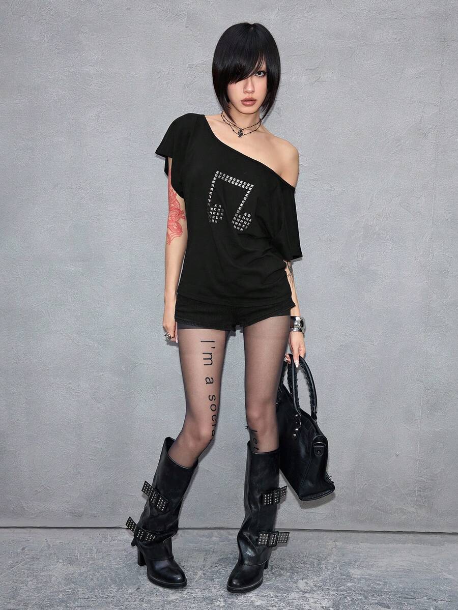 Women's grunge punk style short sleeve t-shirt featuring an asymmetrical neckline, hollow-out cut detail, and relaxed batwing sleeves in a soft cotton stretch fabric.