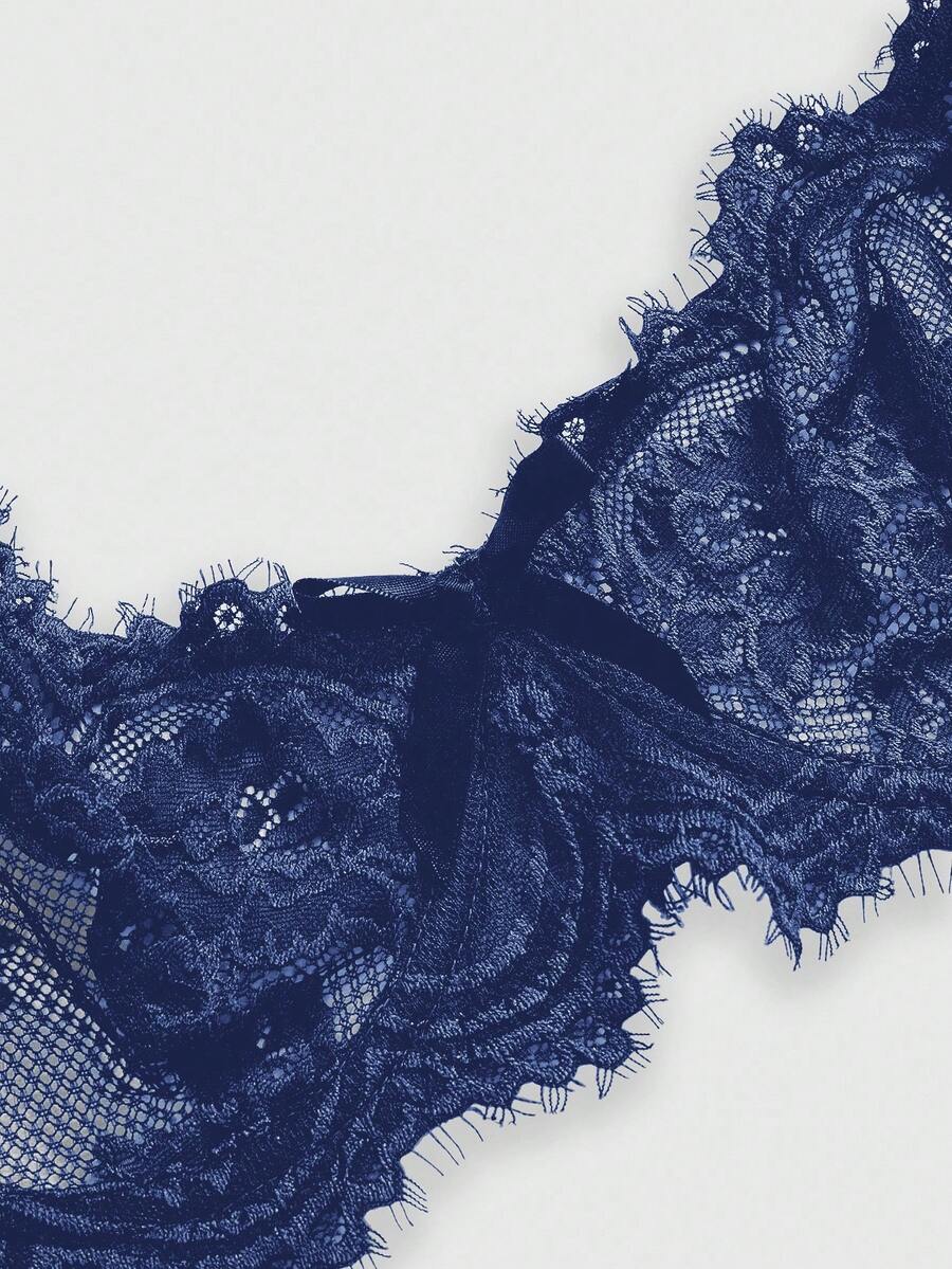 Sheer floral lace underwire triangle bra for women featuring adjustable straps and plunge cup design.