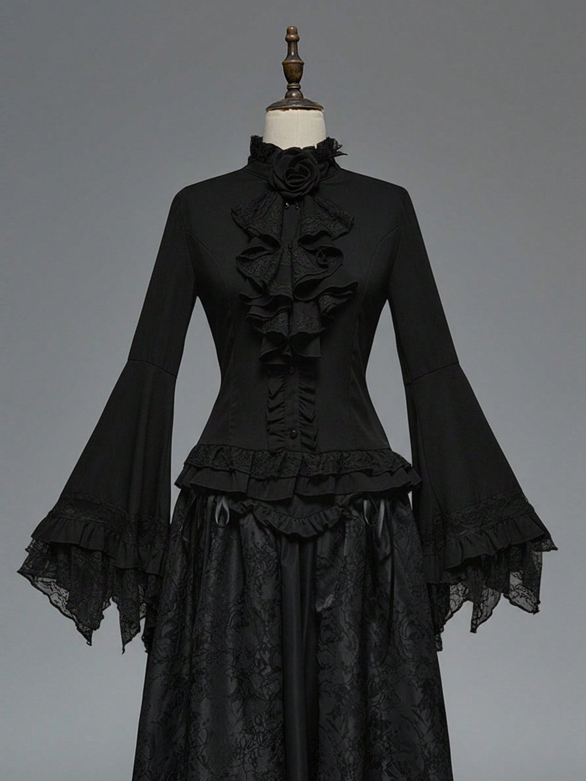 Women's gothic lace blouse with flare long sleeves, tie neckline, and semi-sheer embroidery details.