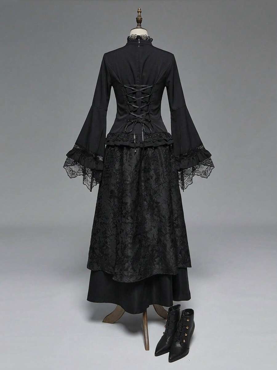 Women's gothic lace blouse with flare long sleeves, tie neckline, and semi-sheer embroidery details.