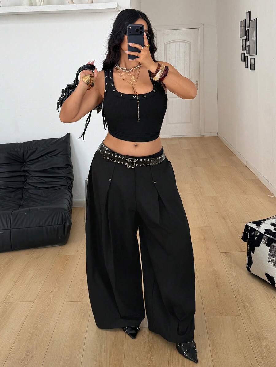 Women's black high-waist wide-leg pants in loose fit woven fabric with button and zipper closure