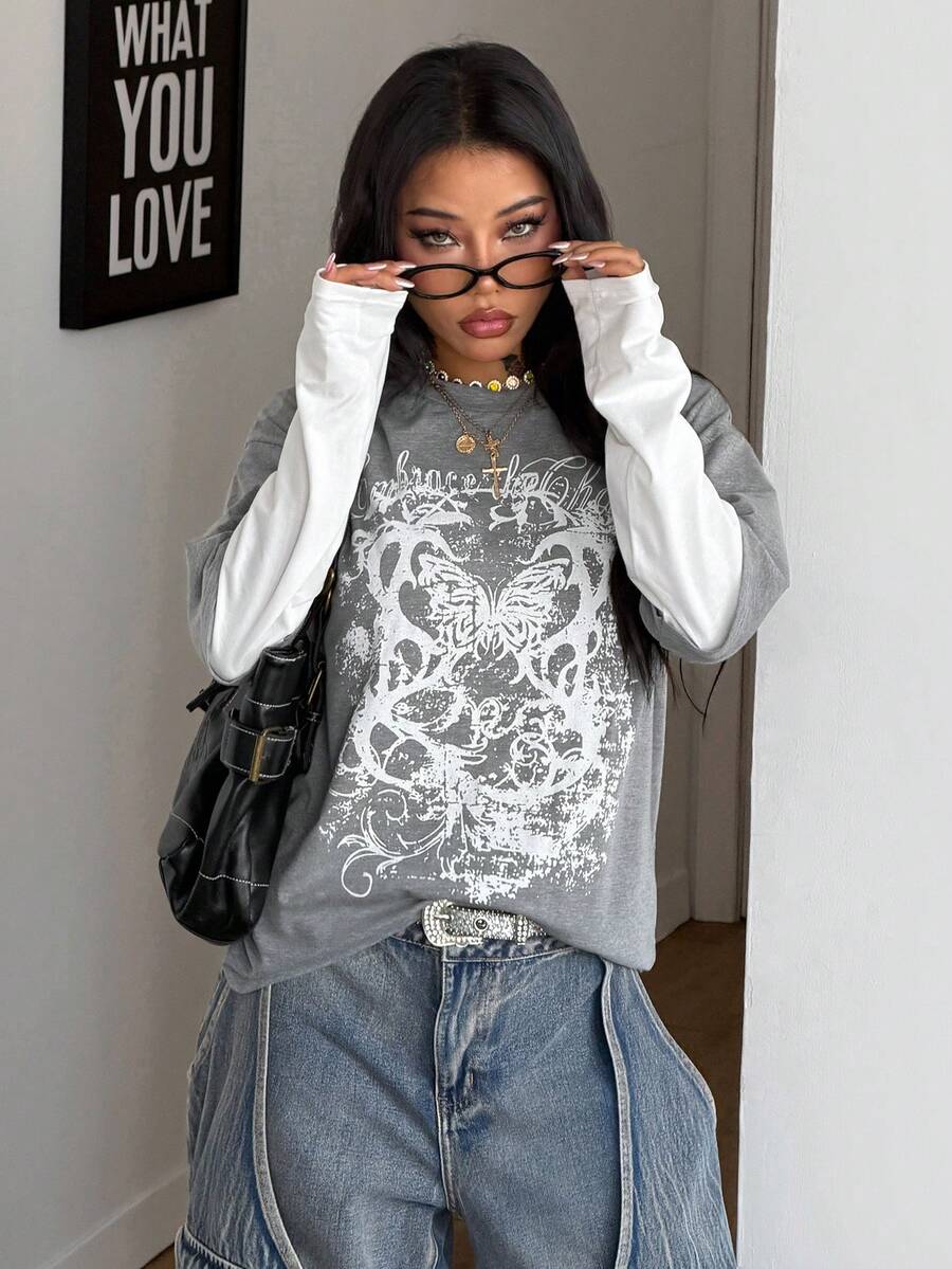 Women's casual graphic long sleeve t-shirt with a round neck, drop shoulder sleeves, and loose relaxed fit.