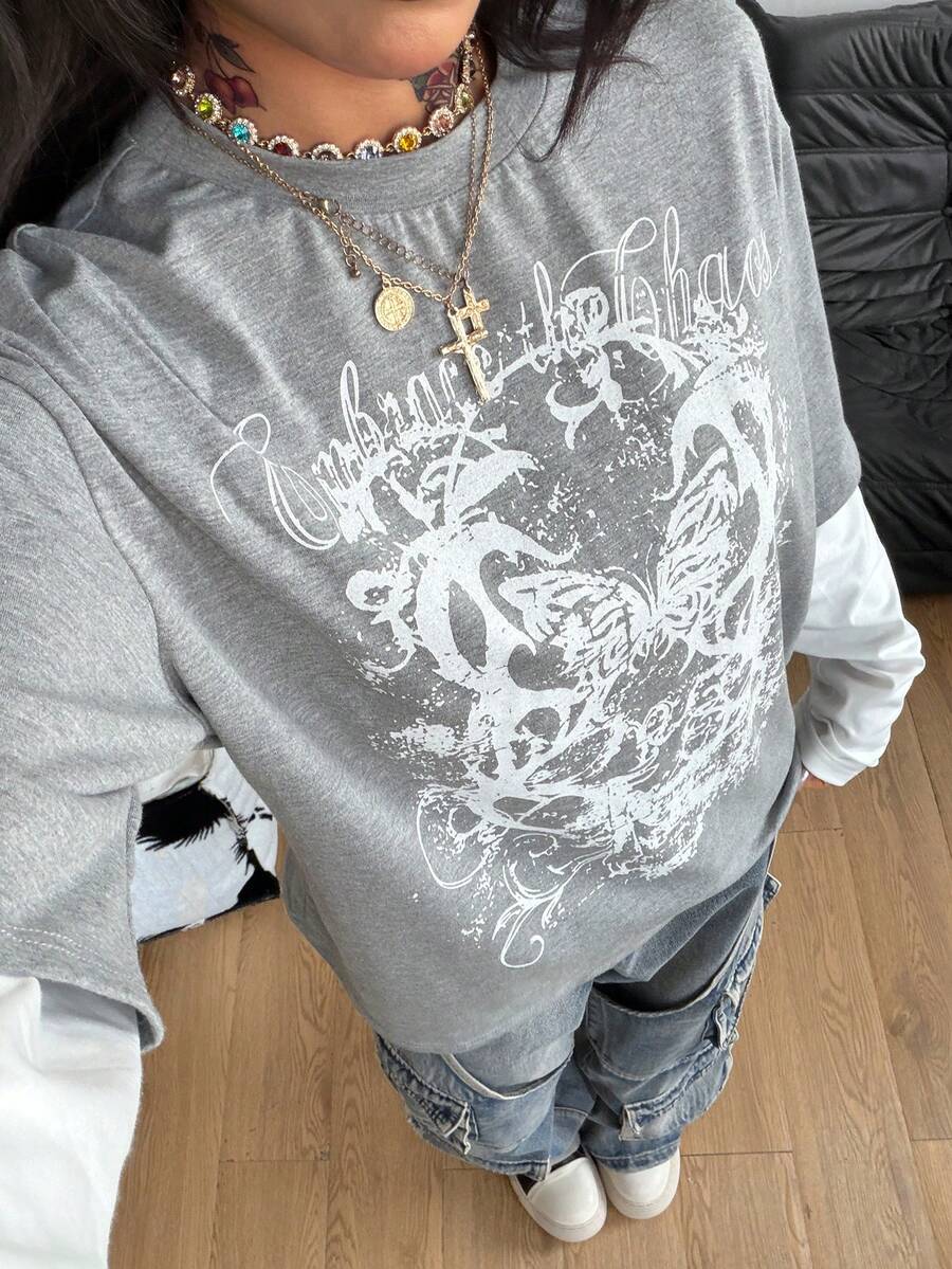 Women's casual graphic long sleeve t-shirt with a round neck, drop shoulder sleeves, and loose relaxed fit.