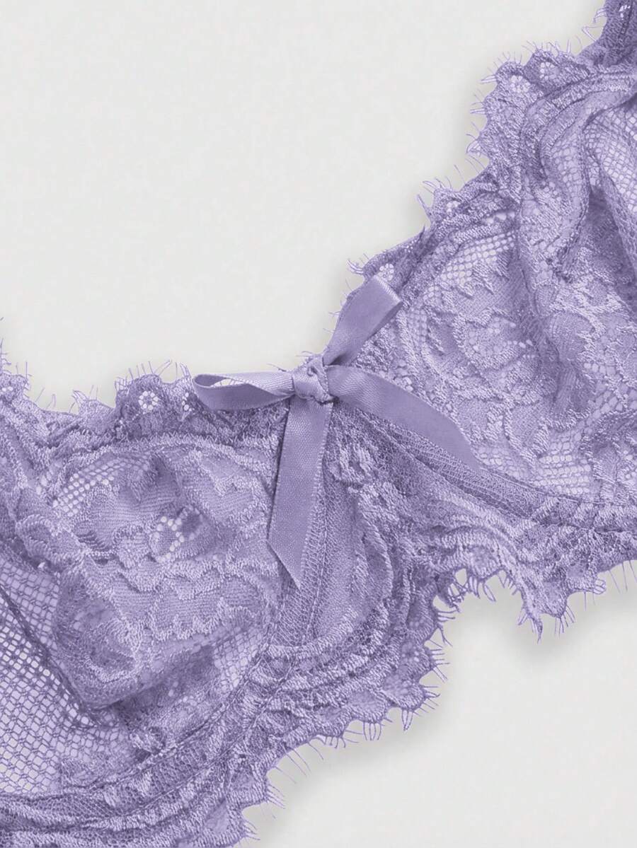 Sheer floral lace underwire triangle bra for women featuring adjustable straps and plunge cup design.