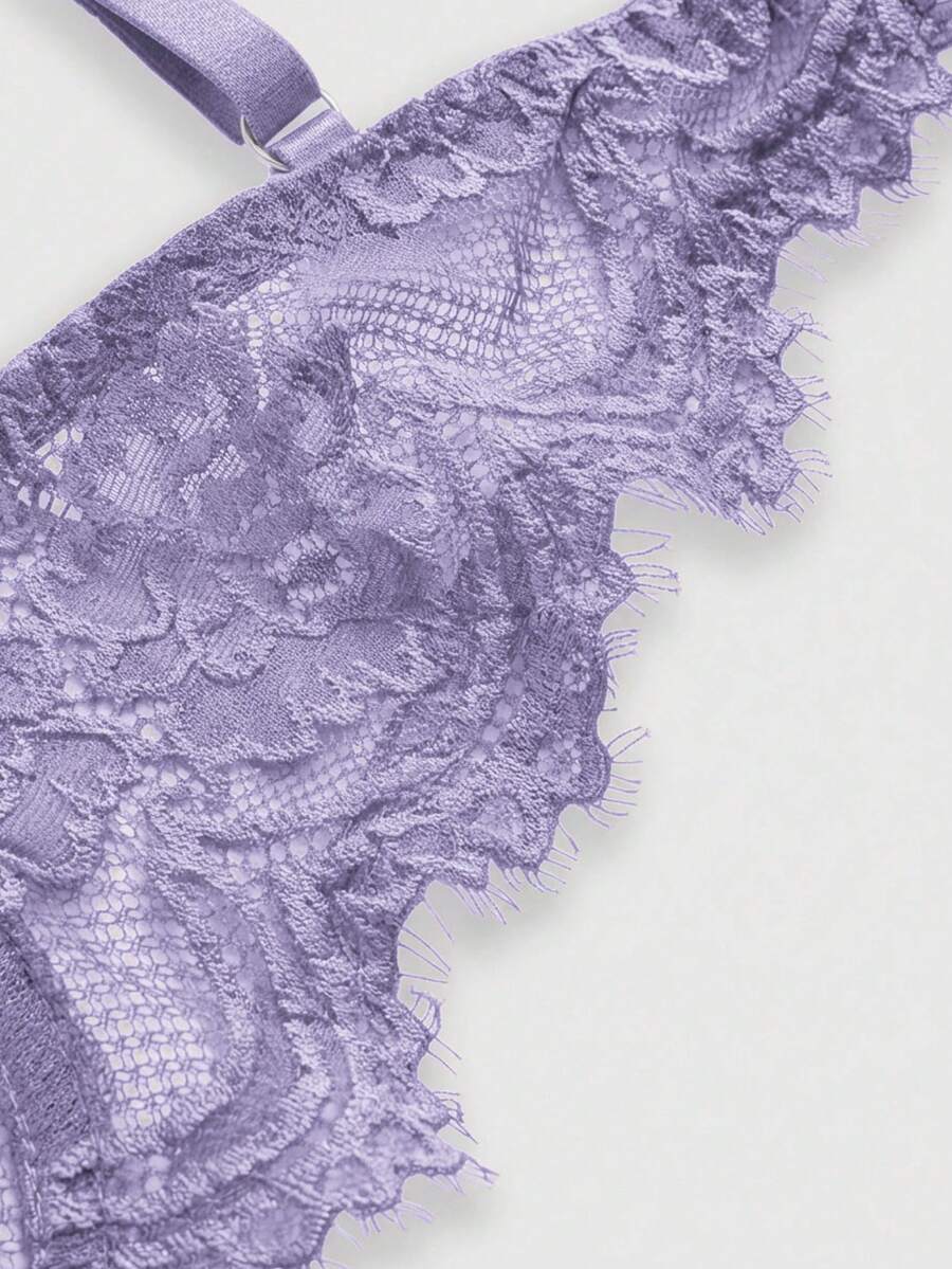 Sheer floral lace underwire triangle bra for women featuring adjustable straps and plunge cup design.