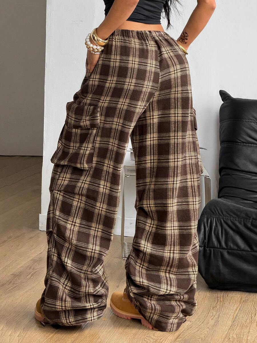 Women's loose fit parachute cargo pants featuring a drawstring waist and functional pockets in a casual streetwear style