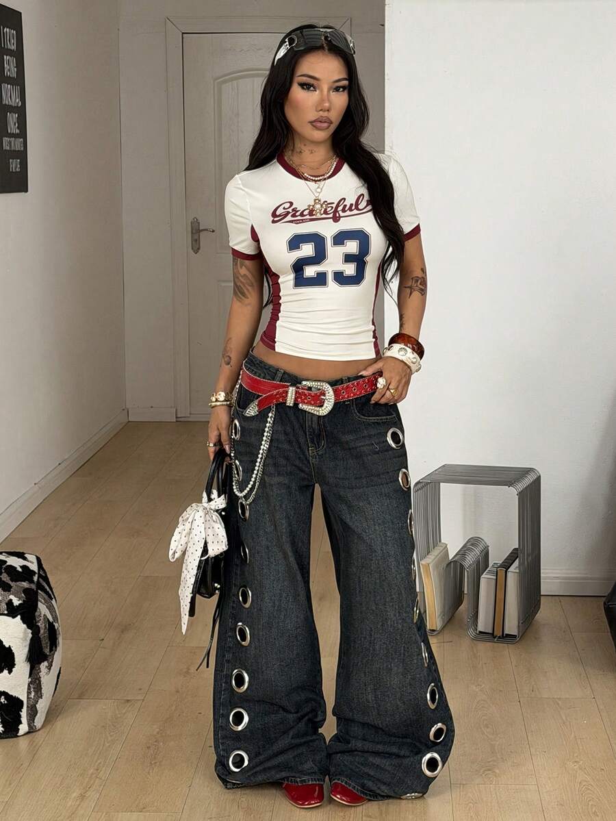 Women's short-sleeve slim fit knit jersey t-shirt featuring a round neck, letter embroidery, and contrast rib-knit trim.