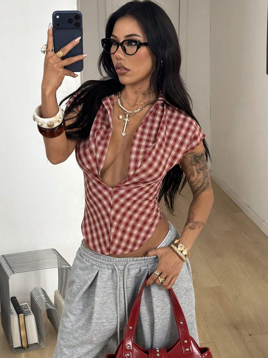 Women's plaid short sleeve shirt featuring a lapel collar and backless design in woven fabric.