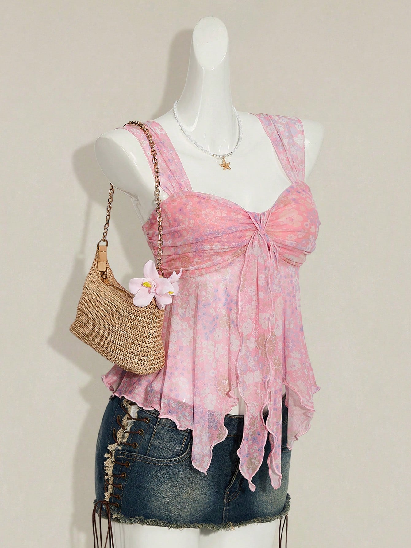 Women's white cherry print cami top with wide straps, ruched knot detail, and an asymmetrical hem