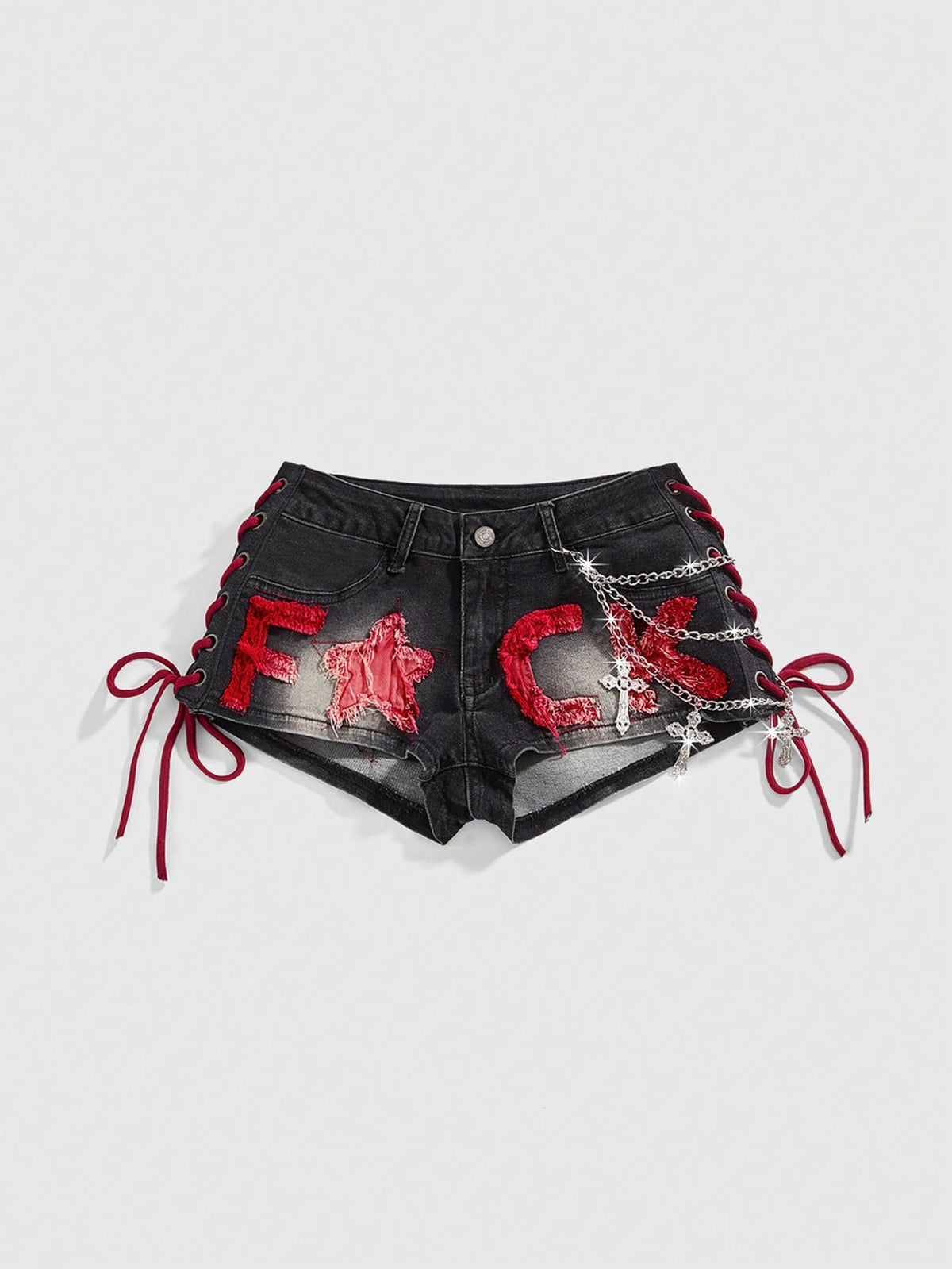 Women's Y2K low waist camo mini skort shorts featuring lace-up knot details, grommet eyelets, graphic lettering pattern, and a zipper fly.