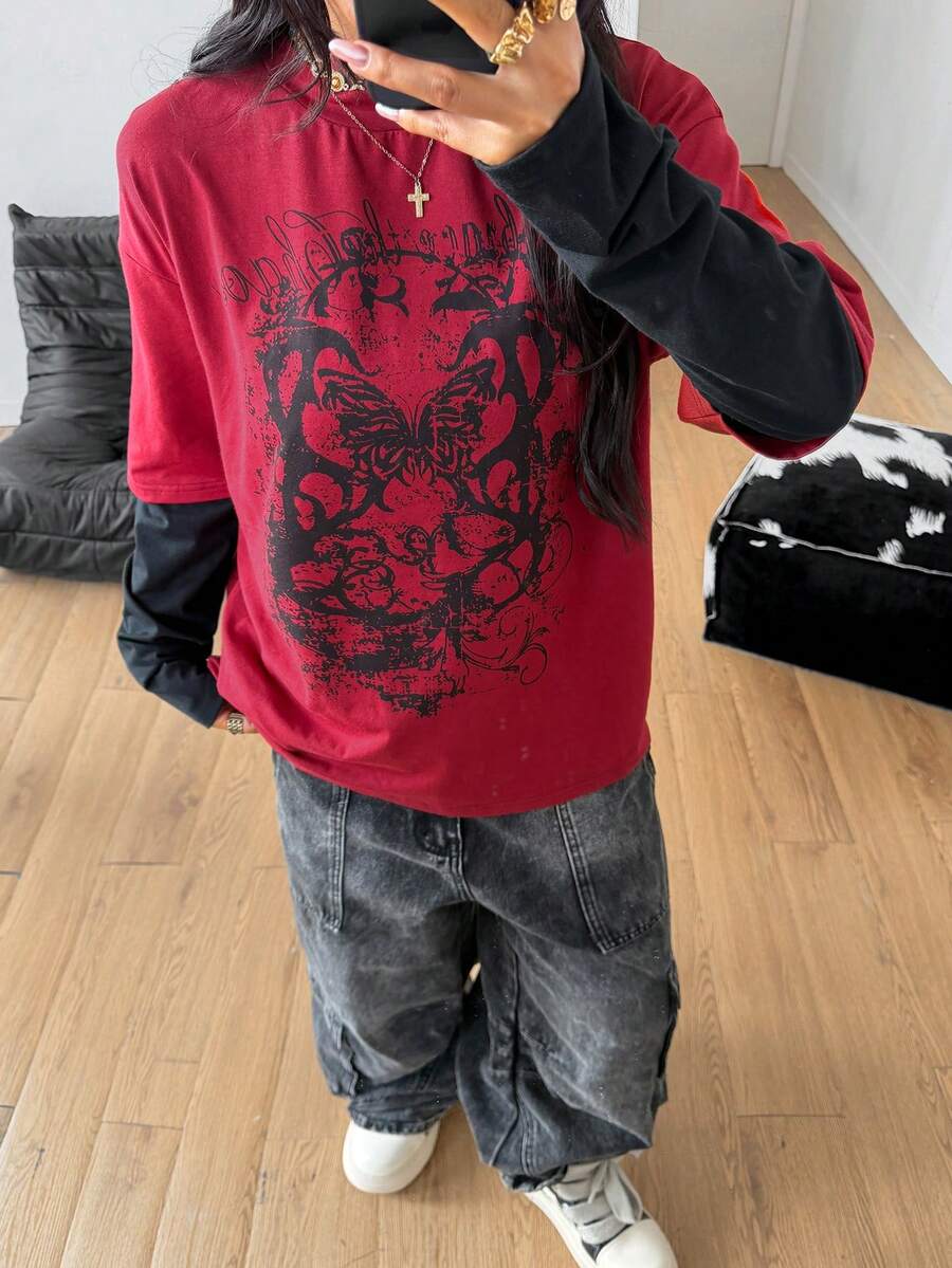Women's casual graphic long sleeve t-shirt with a round neck, drop shoulder sleeves, and loose relaxed fit.