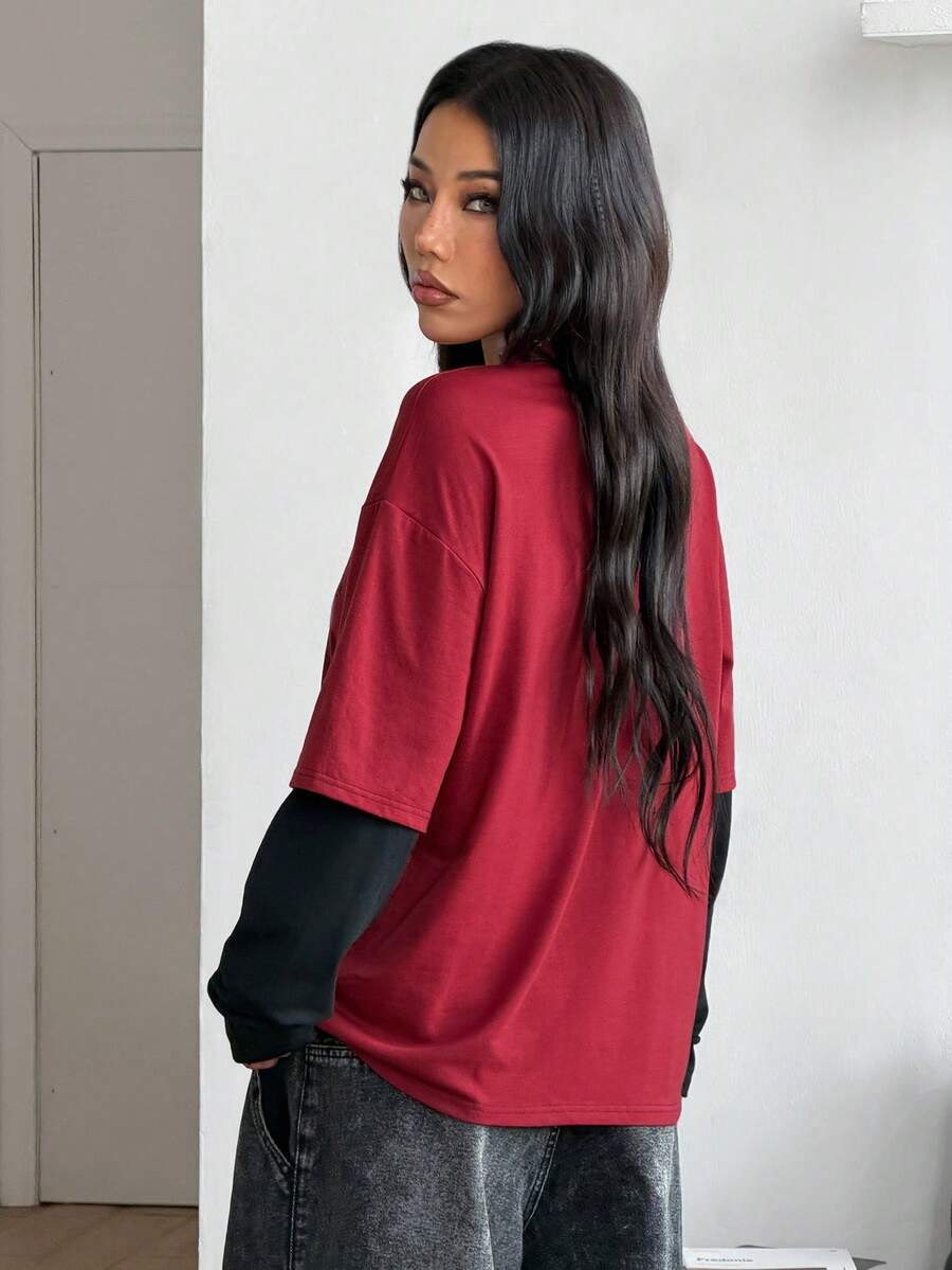 Women's casual graphic long sleeve t-shirt with a round neck, drop shoulder sleeves, and loose relaxed fit.