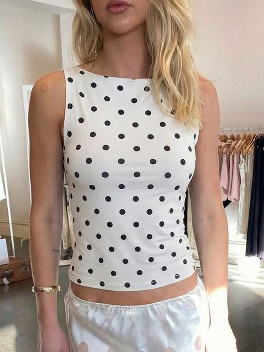 Women's polka dot sleeveless tank top with round neck, ruched rib-knit detail, regular hem, and slim fit casual style