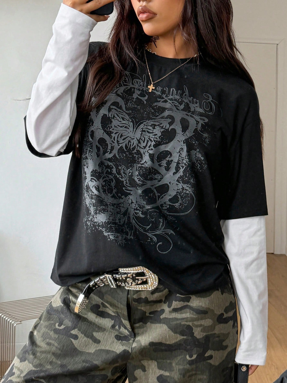 Women's casual graphic long sleeve t-shirt with a round neck, drop shoulder sleeves, and loose relaxed fit.