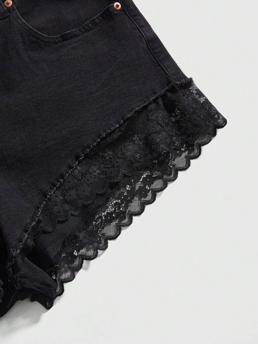 Front view of women's plus size skinny denim shorts featuring lace patchwork detailing, mid-rise waist, button zipper closure, and classic pockets.