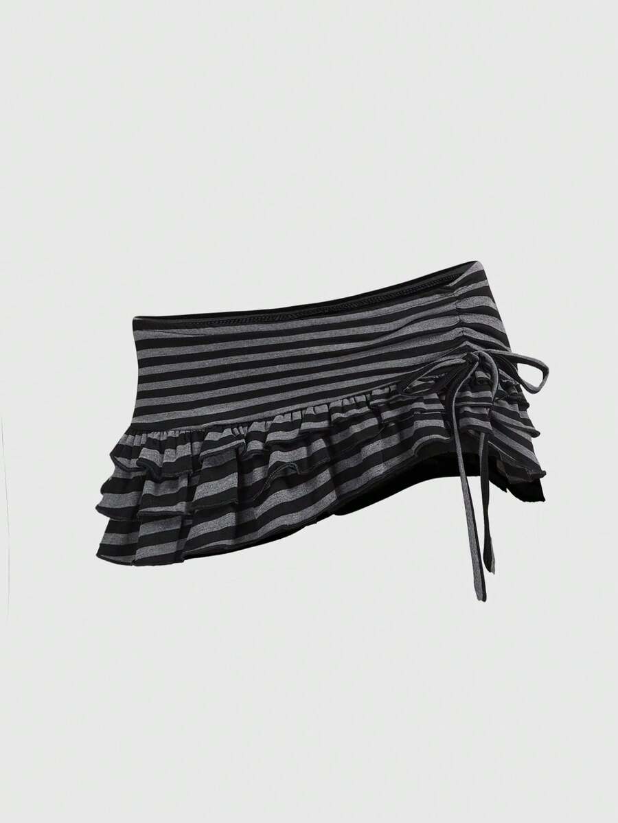Women's black low-waist mini skirt with drawstring tie, ruched details, lace trim, layered ruffle hem, and asymmetric styling
