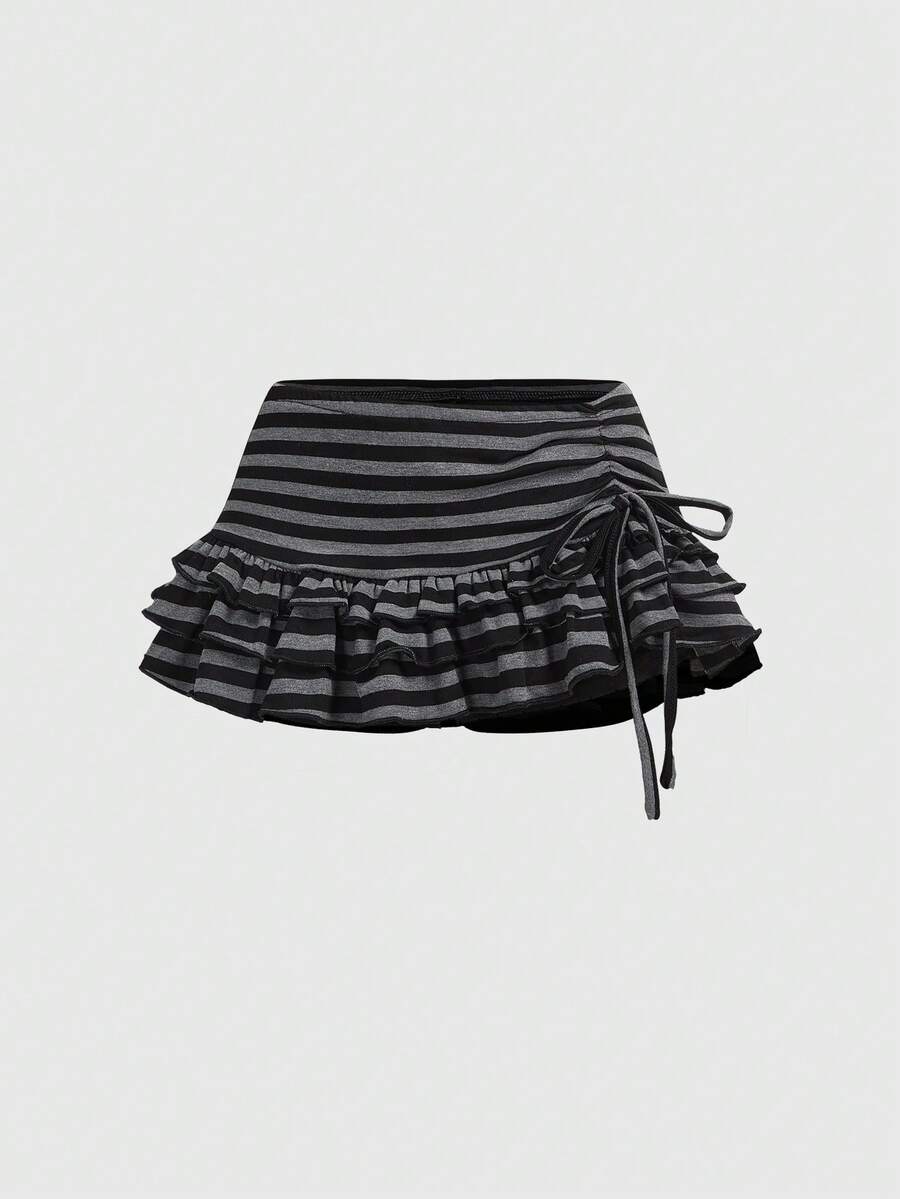 Women's black low-waist mini skirt with drawstring tie, ruched details, lace trim, layered ruffle hem, and asymmetric styling