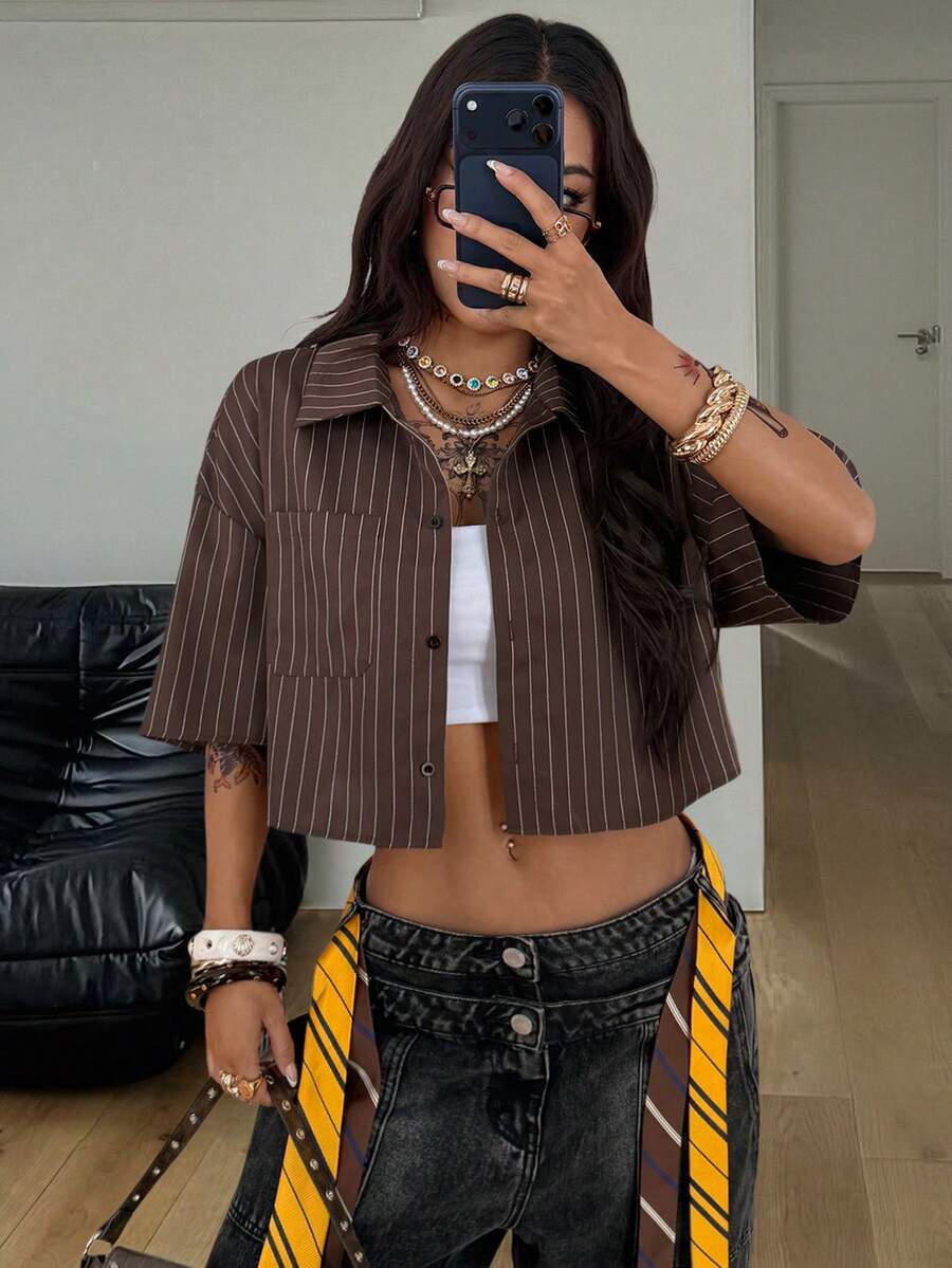 Women's plaid crop shirt with button front, chest pocket, short sleeves, and loose casual fit.