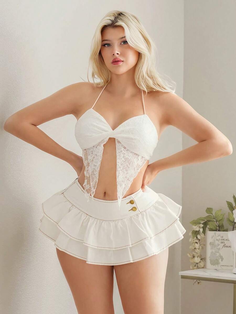 Y2K ultra low waist mini skirt with tiered layer detail, ruffle hem, zipper closure, straight silhouette, and fabric.