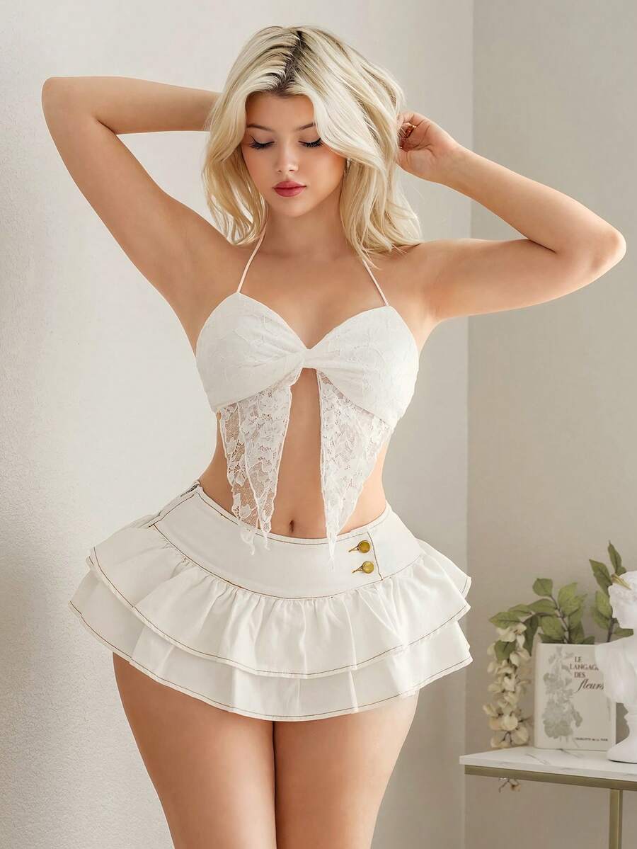 Y2K ultra low waist mini skirt with tiered layer detail, ruffle hem, zipper closure, straight silhouette, and fabric.