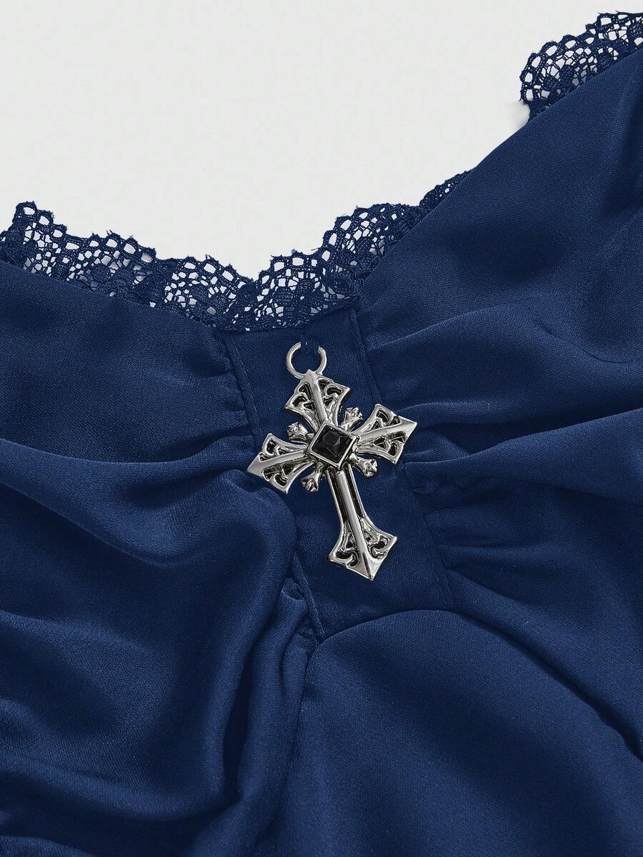 Women's vintage gothic cami dress with high-waist lace-up detail, spaghetti straps, zipper closure, and an asymmetrical knee-length hem.