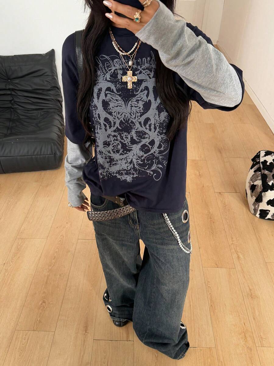 Women's casual graphic long sleeve t-shirt with a round neck, drop shoulder sleeves, and loose relaxed fit.