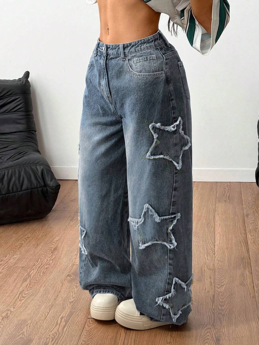 Front view of women's loose wide leg denim jeans featuring a mid waist, classic front pockets, and a zipper fly closure.