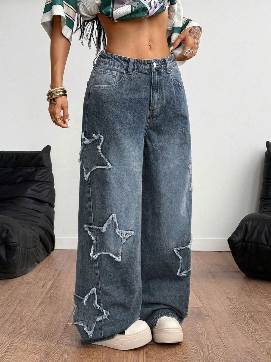 Front view of women's loose wide leg denim jeans featuring a mid waist, classic front pockets, and a zipper fly closure.