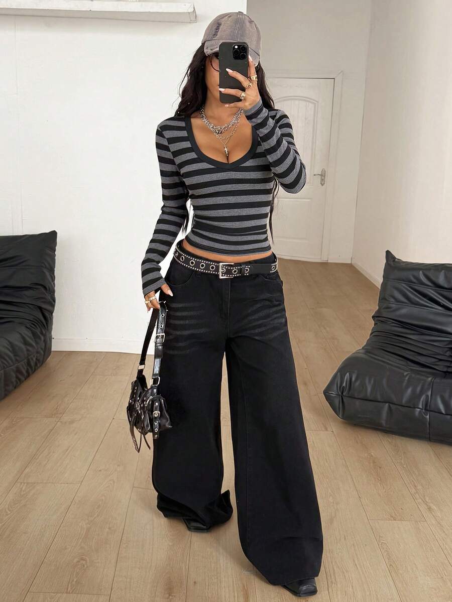 Women's slim fit long sleeve t-shirt with a deep V-neck cut from stretchy knit fabric.
