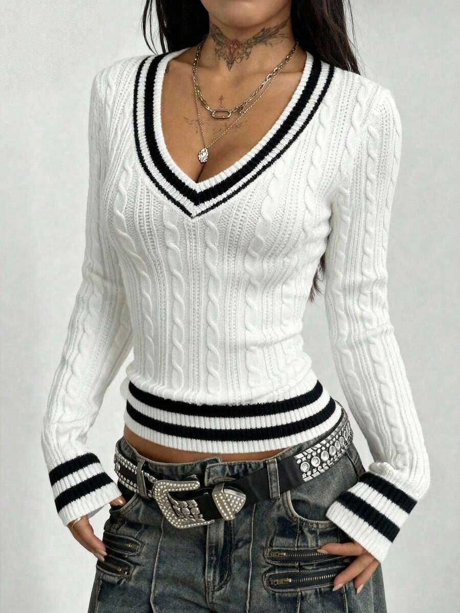Women's slim fit cable-knit sweater with a V-neckline and long sleeves in solid green rib knit fabric.