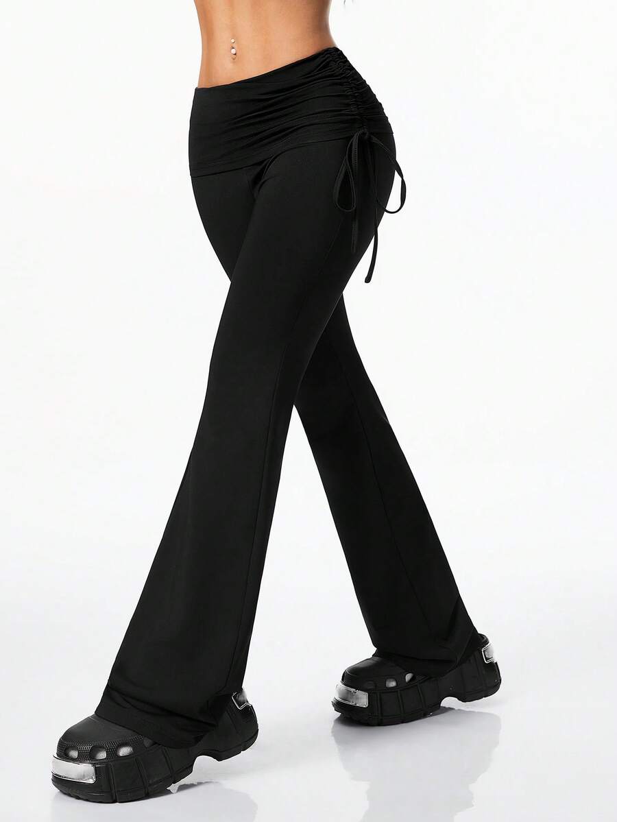 Women's striped flare leg pants featuring a mid-rise waist, slim fit thigh, and ruched side drawstring detail in stretch knit fabric.