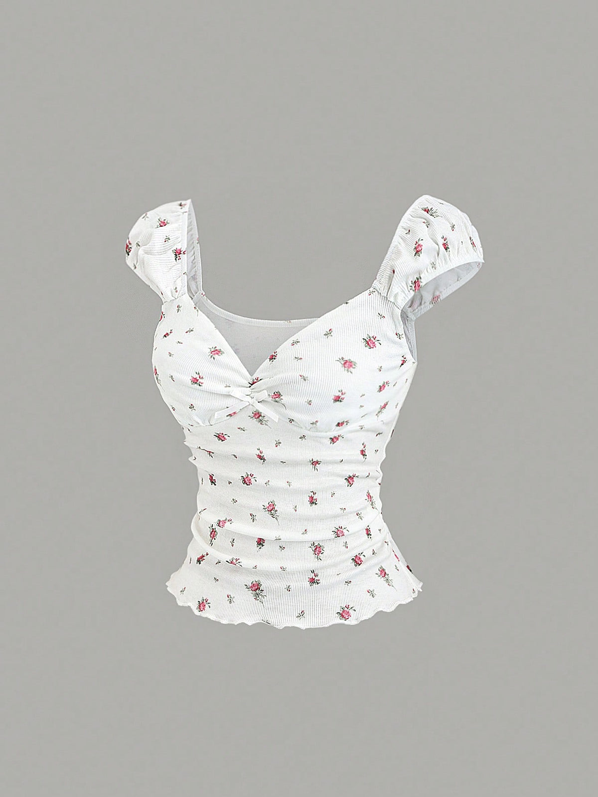 Women's short sleeve knit top with a sweetheart neckline and ruched twist knot front detail.