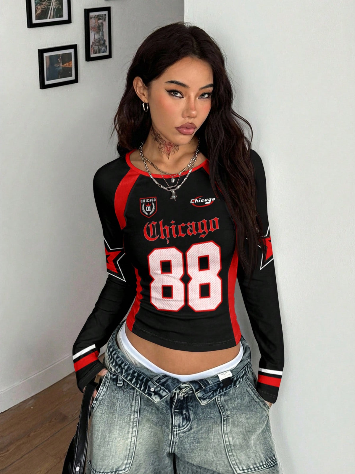 Women's slim fit long sleeve raglan t-shirt with collegiate letter graphic print, round neck, and contrast binding.