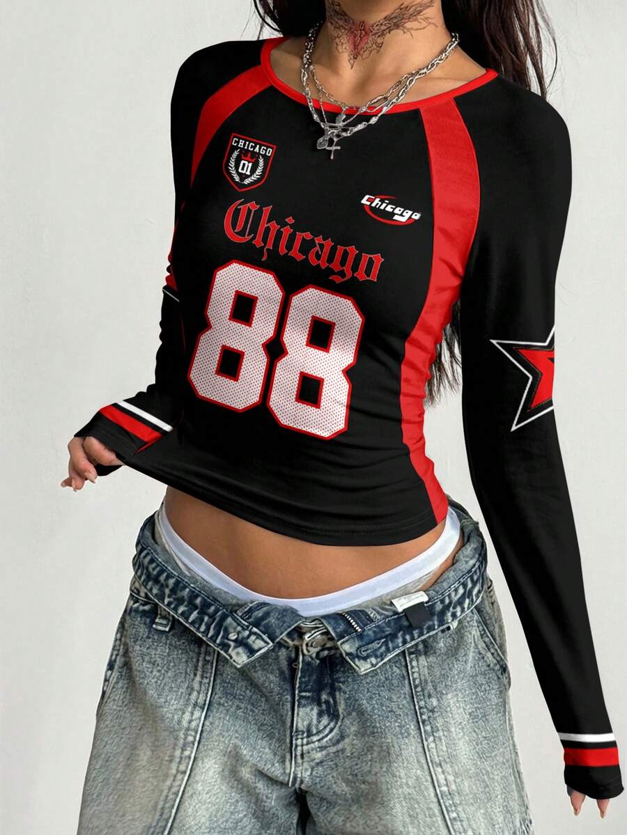 Women's slim fit long sleeve raglan t-shirt with collegiate letter graphic print, round neck, and contrast binding.