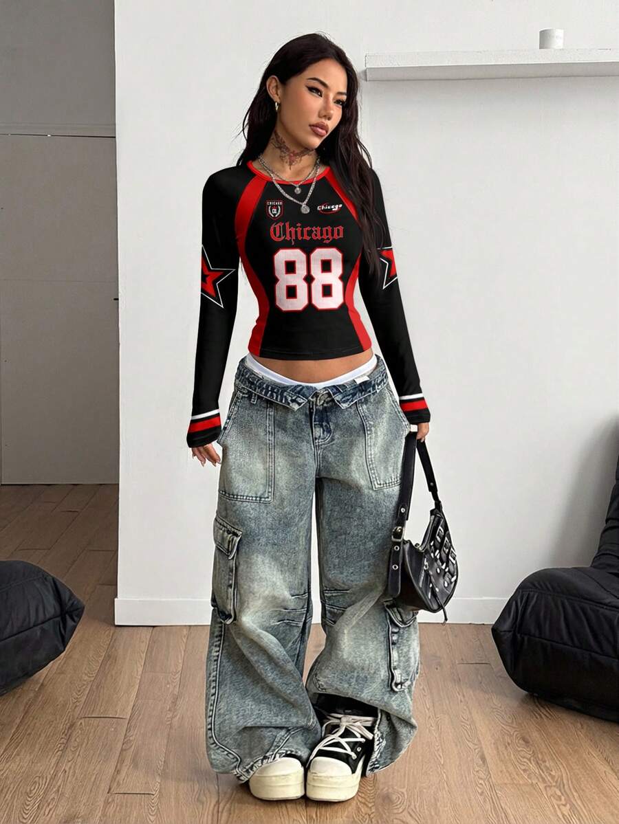 Women's slim fit long sleeve raglan t-shirt with collegiate letter graphic print, round neck, and contrast binding.