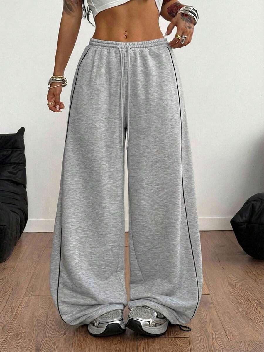 Women's wide leg trousers with a tree branch graphic pattern, loose fit, and mid-rise waist in woven fabric.