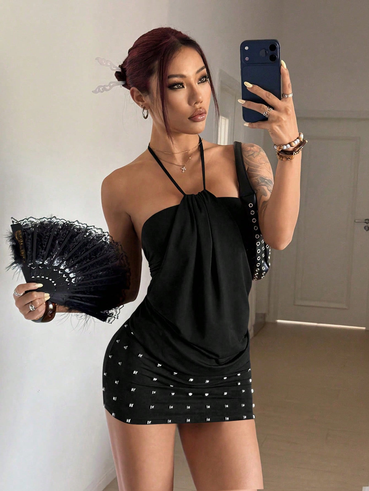 Women's brown beaded halter mini dress with a backless tie-back knot design, sleeveless slim fit silhouette, and pencil hem.