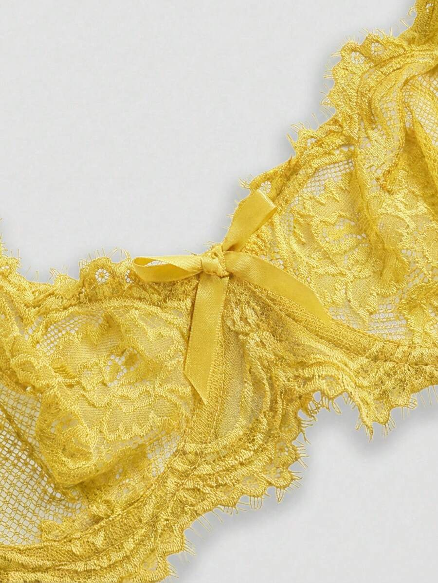 Sheer floral lace underwire triangle bra for women featuring adjustable straps and plunge cup design.