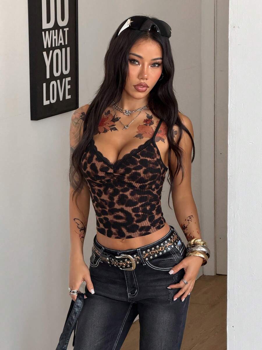 Women's black lace crop cami top featuring spaghetti straps, cold shoulder sleeves, and a sheer backless design.