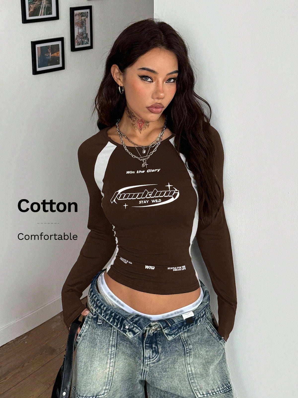 Women's slim fit long sleeve raglan t-shirt with collegiate letter graphic print, round neck, and contrast binding.