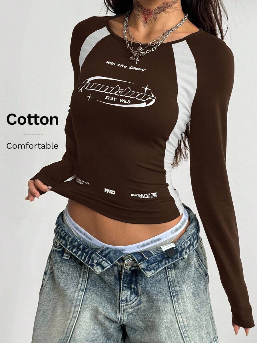 Women's slim fit long sleeve raglan t-shirt with collegiate letter graphic print, round neck, and contrast binding.