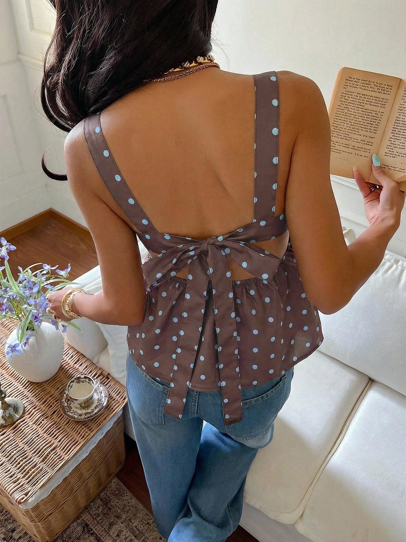 Women's casual polka dot tank top with tie-front knot, strap neckline, backless design, and ruffle flared hem
