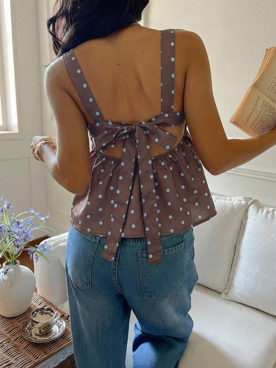 Women's casual polka dot tank top with tie-front knot, strap neckline, backless design, and ruffle flared hem