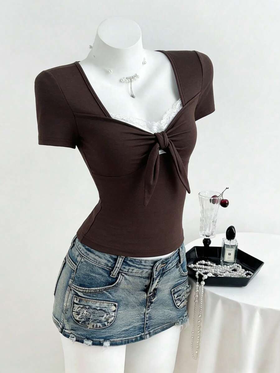 Women's casual short sleeve rib-knit t-shirt with a square neckline, contrast lace detailing, and ruched front.