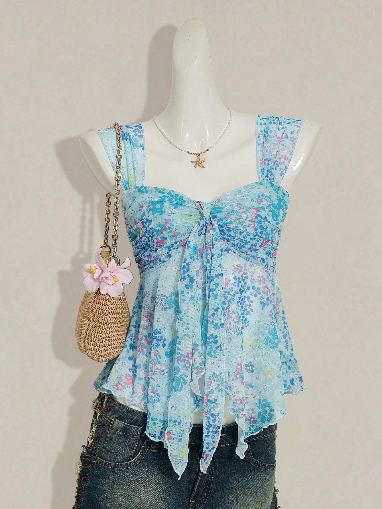 Women's white cherry print cami top with wide straps, ruched knot detail, and an asymmetrical hem
