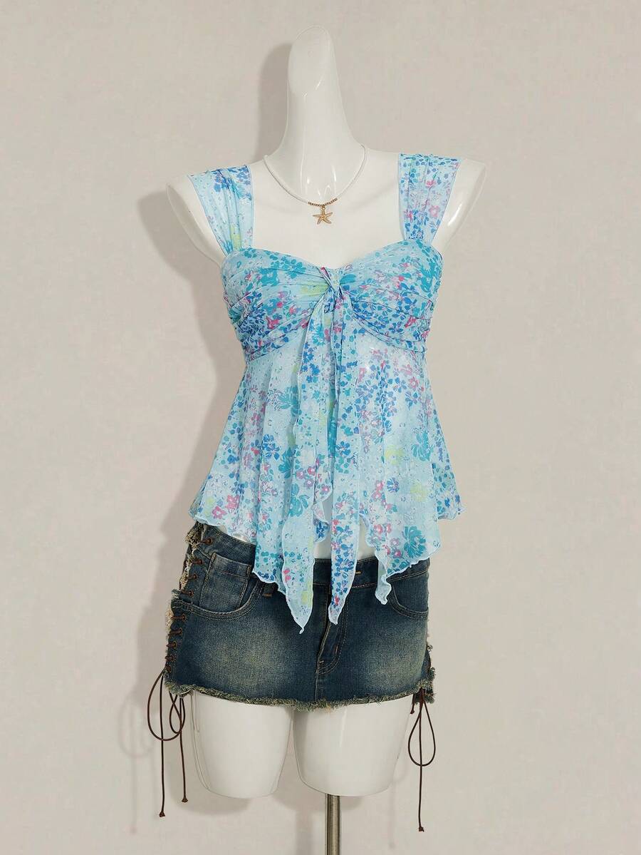 Women's white cherry print cami top with wide straps, ruched knot detail, and an asymmetrical hem